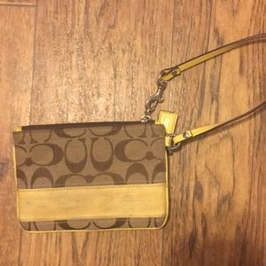 Coach wristlet with yellow accent